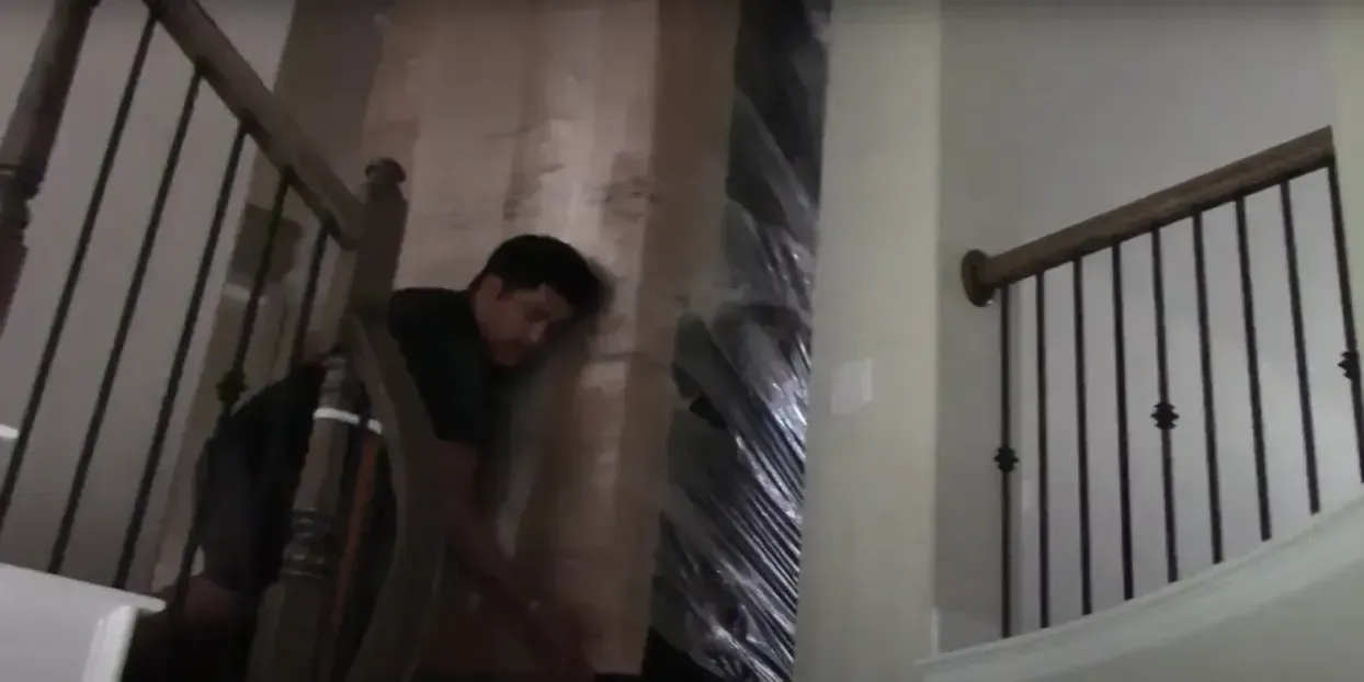 Professional movers carrying boxes